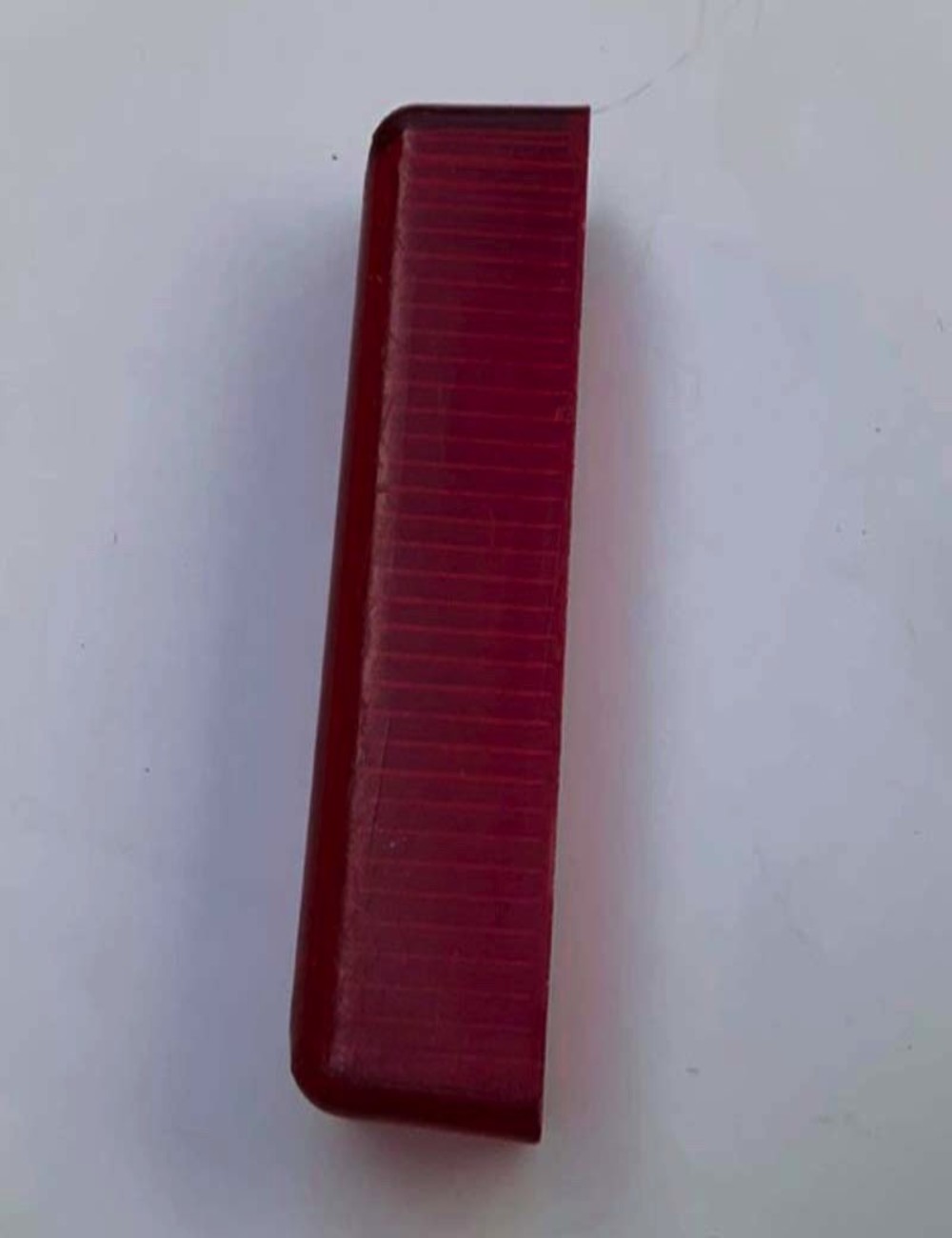 Ricambio per luce targa. Colore: rosso